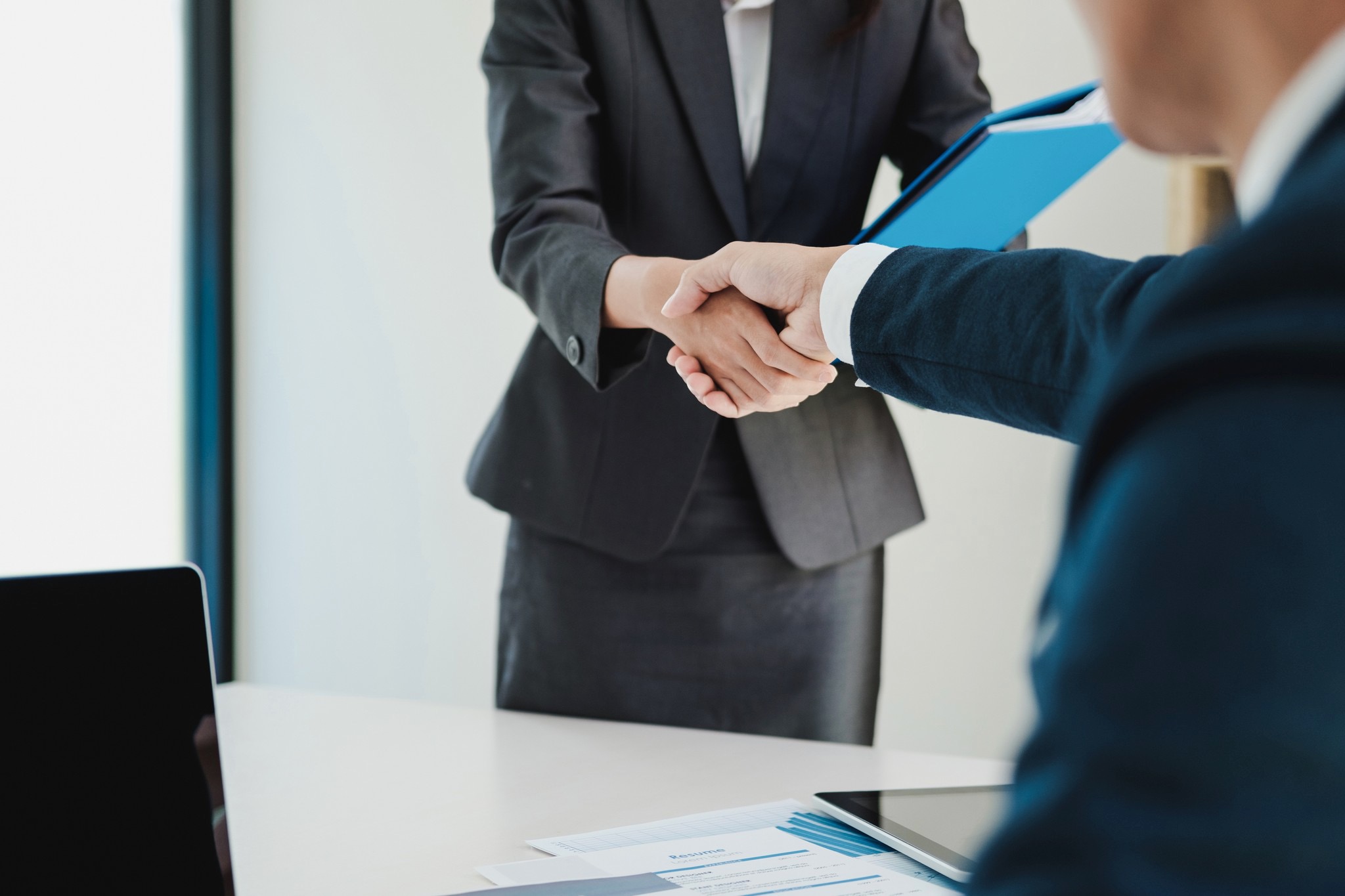 Smart Woman Having A Successful Job Interview, The Examiner Is Shaking Her Hand